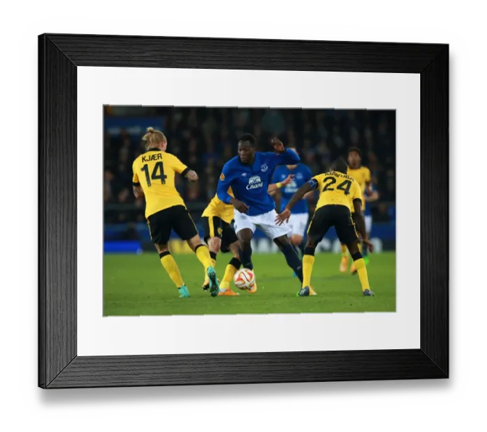 Framed Print : Everton's Lukaku Fights for Ball against Lille's Defense in Europa League Match Framed Print : Everton's Lukaku Fights for Ball against Lille's Defense in Europa League Match