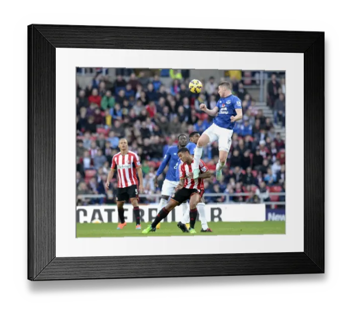 Framed Print : Intense Header Battle: McCarthy vs Bridcutt in Sunderland vs Everton Premier League Clash Framed Print : Intense Header Battle: McCarthy vs Bridcutt in Sunderland vs Everton Premier League Clash