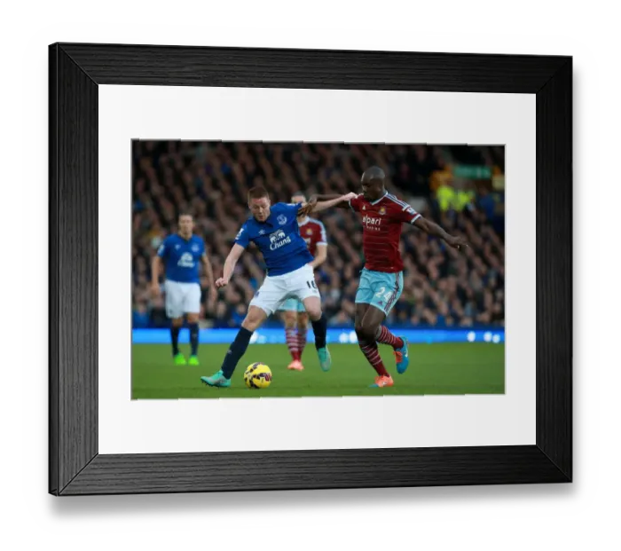 Framed Print : McCarthy vs. Cole: Intense Battle for Ball in Everton vs. West Ham Premier League Clash Framed Print : McCarthy vs. Cole: Intense Battle for Ball in Everton vs. West Ham Premier League Clash
