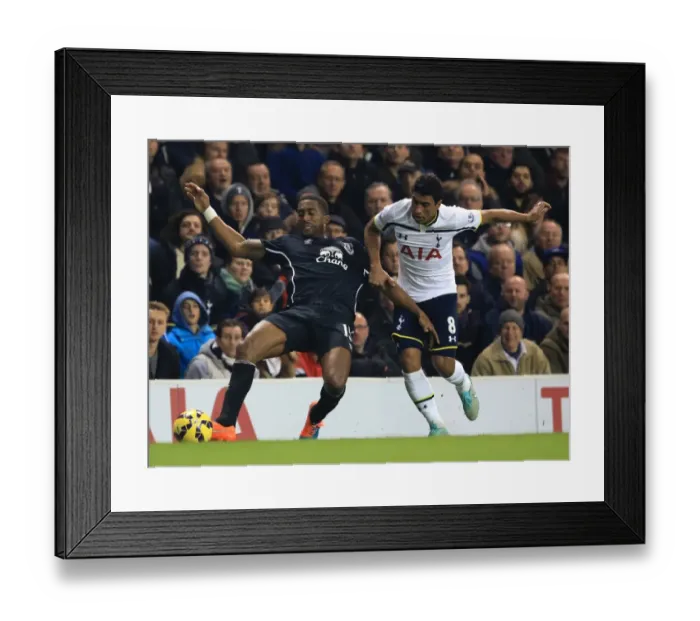 Framed Print : Intense Rivalry: Paulinho vs. Distin - Tottenham Hotspur vs. Everton: A Battle for Supremacy in the Premier League Framed Print : Intense Rivalry: Paulinho vs. Distin - Tottenham Hotspur vs. Everton: A Battle for Supremacy in the Premier League