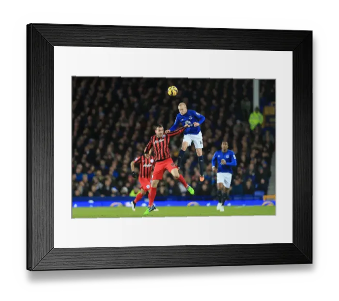 Framed Print : Naismith vs Mutch: Aerial Clash at Goodison Park - Everton vs Queens Park Rangers, Premier League Framed Print : Naismith vs Mutch: Aerial Clash at Goodison Park - Everton vs Queens Park Rangers, Premier League