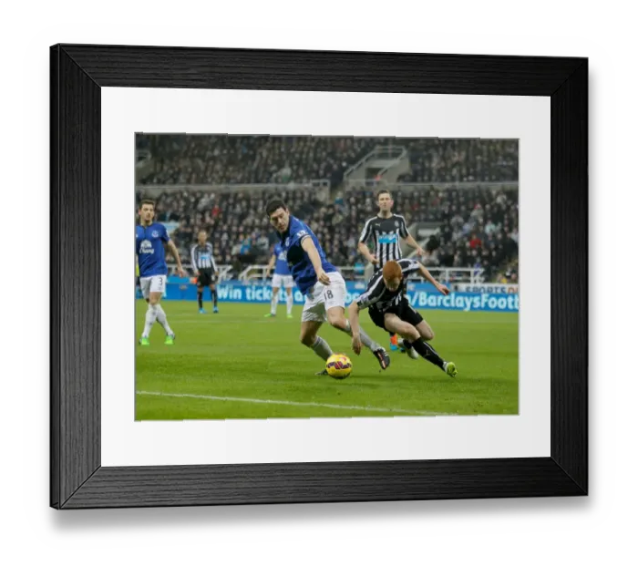 Framed Print : Intense Rivalry: Gareth Barry vs Jack Colback Battle at St James Park, Premier League