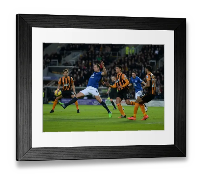 Framed Print : Intense Rivalry: Jagielka vs. Davies Battle at KC Stadium - Hull City vs. Everton, Premier League