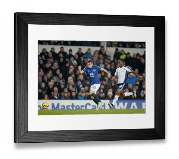 Framed Print : Intense Battle for Ball Possession: Seamus Coleman vs. Saido Berahino - Everton vs. West Bromwich Albion, Premier League Framed Print : Intense Battle for Ball Possession: Seamus Coleman vs. Saido Berahino - Everton vs. West Bromwich Albion, Premier League