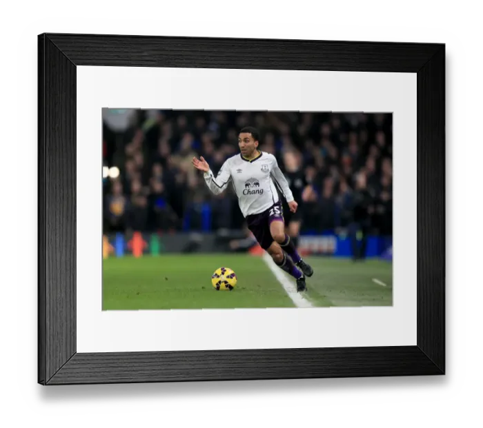 Framed Print : Aaron Lennon Charges Forward in Premier League Clash at Stamford Bridge Framed Print : Aaron Lennon Charges Forward in Premier League Clash at Stamford Bridge