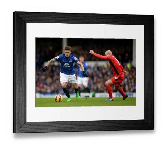 Framed Print : Intense Rivalry: Besic vs. Cambiasso Battle for Ball at Goodison Park - Everton vs. Leicester City, Premier League Framed Print : Intense Rivalry: Besic vs. Cambiasso Battle for Ball at Goodison Park - Everton vs. Leicester City, Premier League
