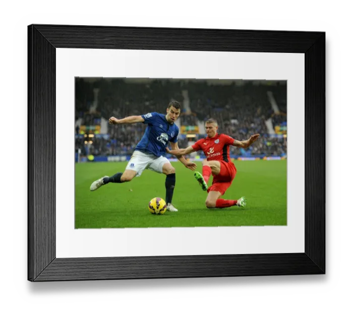 Framed Print : Seamus Coleman vs. Paul Konchesky: A Premier League Slide Tackle Showdown at Goodison Park