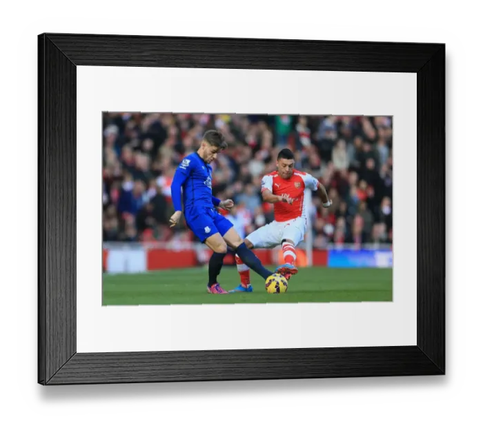 Framed Print : Battle for the Ball: Oxlade-Chamberlain vs. Garbutt - Arsenal vs. Everton Premier League Clash Framed Print : Battle for the Ball: Oxlade-Chamberlain vs. Garbutt - Arsenal vs. Everton Premier League Clash