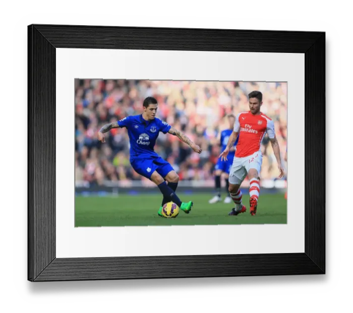 Framed Print : Intense Rivalry on the Pitch: Giroud vs Besic - Arsenal vs Everton, Premier League Showdown Framed Print : Intense Rivalry on the Pitch: Giroud vs Besic - Arsenal vs Everton, Premier League Showdown
