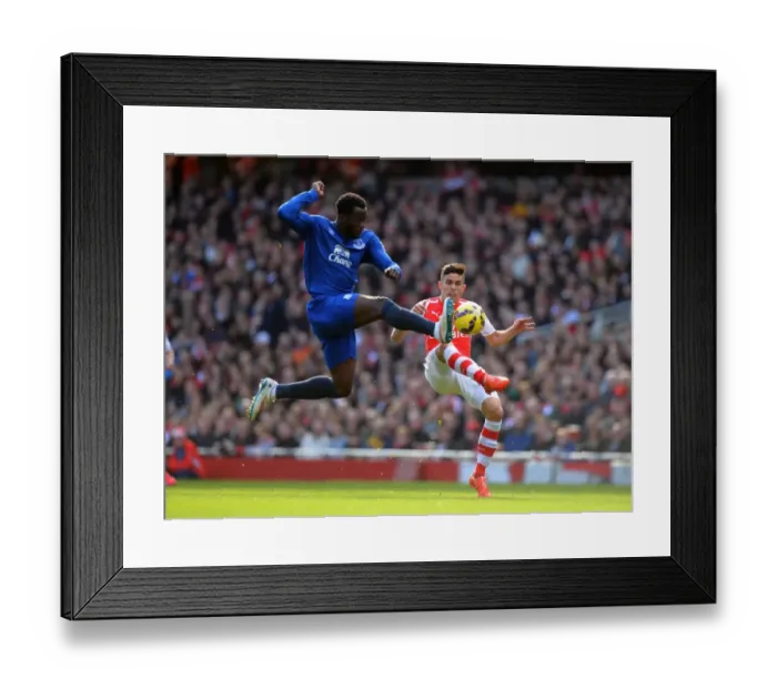 Framed Print : Lukaku vs. Gabriel: Intense Tackle in Arsenal vs. Everton Premier League Clash (2015) Framed Print : Lukaku vs. Gabriel: Intense Tackle in Arsenal vs. Everton Premier League Clash (2015)