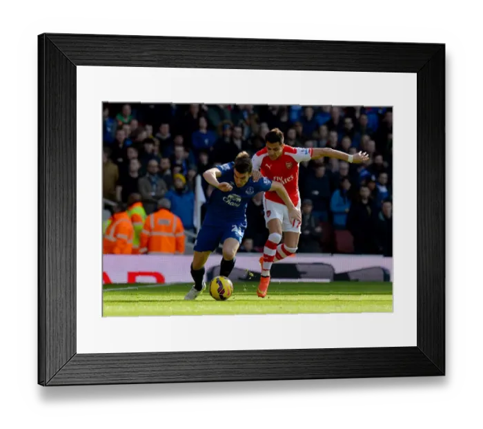Framed Print : Sanchez vs. Coleman: Intense Moment in Arsenal vs. Everton Premier League Clash