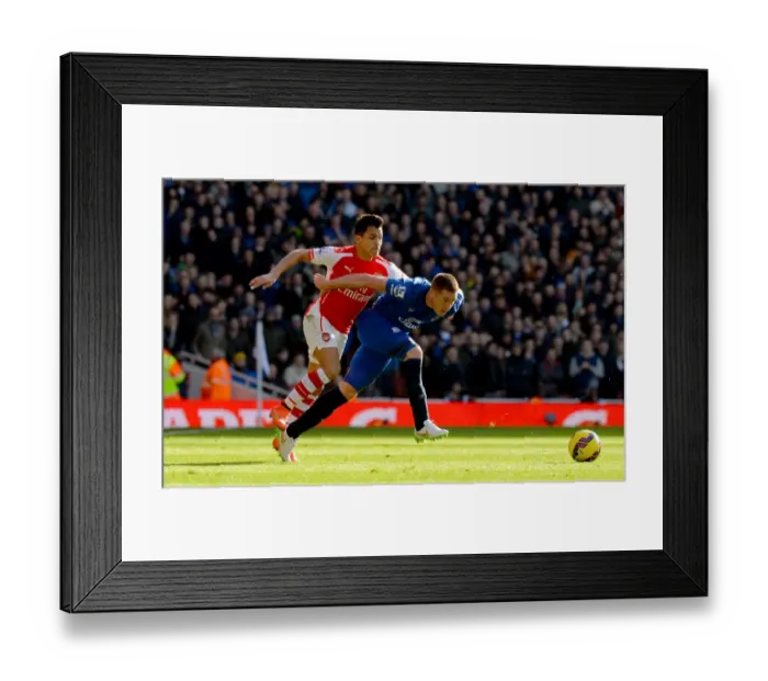 Framed Print : Intense Clash: Sanchez Tackles McCarthy in Arsenal vs. Everton (Barclays Premier League) Framed Print : Intense Clash: Sanchez Tackles McCarthy in Arsenal vs. Everton (Barclays Premier League)