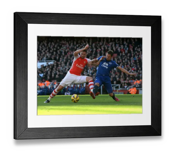 Framed Print : Intense Battle: Giroud vs Jagielka - Arsenal vs Everton, Premier League Framed Print : Intense Battle: Giroud vs Jagielka - Arsenal vs Everton, Premier League