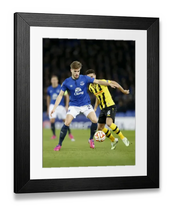 Framed Print : A Battle for the Ball: Everton vs BSC Young Boys - UEFA Europa League Round of 32, Goodison Park