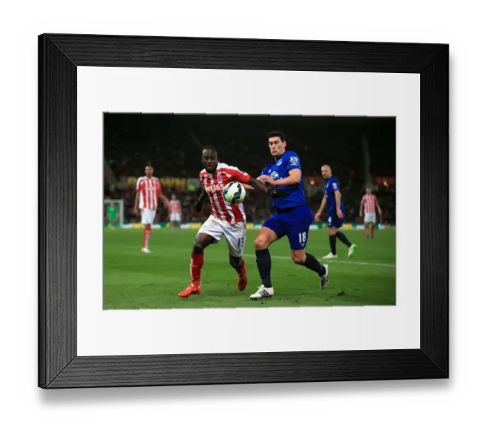 Framed Print : Intense Battle for Possession: Gareth Barry (Everton) vs. Victor Moses (Stoke City) in the Barclays Premier League Framed Print : Intense Battle for Possession: Gareth Barry (Everton) vs. Victor Moses (Stoke City) in the Barclays Premier League