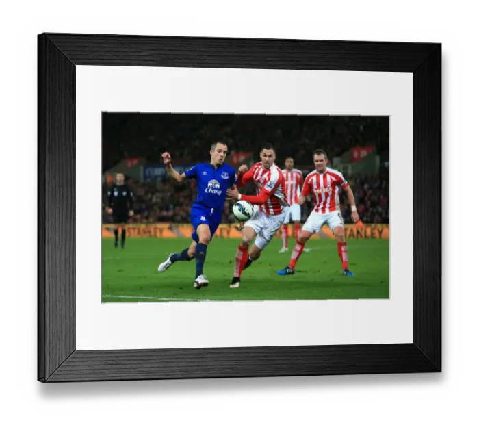 Framed Print : Battling for Ball Supremacy: Osman vs. Cameron at Britannia Stadium - Everton vs. Stoke City Framed Print : Battling for Ball Supremacy: Osman vs. Cameron at Britannia Stadium - Everton vs. Stoke City