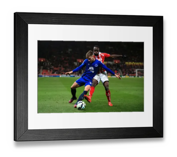 Framed Print : Battling for Control: Moses vs. Garbutt in Stoke City vs. Everton Premier League Clash Framed Print : Battling for Control: Moses vs. Garbutt in Stoke City vs. Everton Premier League Clash