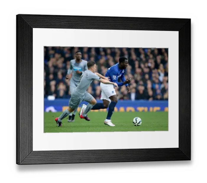 Framed Print : Intense Battle: Lukaku vs. Taylor at Goodison Park - Everton vs. Newcastle United, Premier League Framed Print : Intense Battle: Lukaku vs. Taylor at Goodison Park - Everton vs. Newcastle United, Premier League