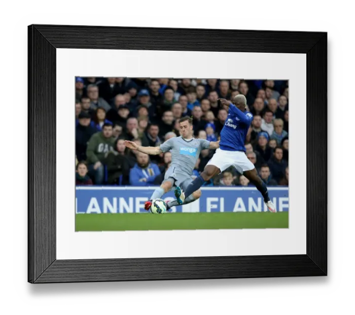 Framed Print : Arouna Kone vs Ryan Taylor: Intense Clash at Goodison Park - Barclays Premier League Framed Print : Arouna Kone vs Ryan Taylor: Intense Clash at Goodison Park - Barclays Premier League