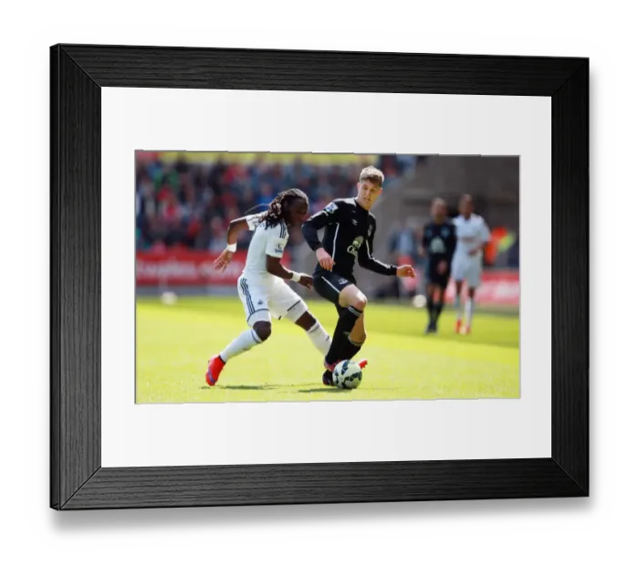 Framed Print : Clash of Stars: Emnes vs. Stones - Swansea City vs. Everton, Barclays Premier League Framed Print : Clash of Stars: Emnes vs. Stones - Swansea City vs. Everton, Barclays Premier League