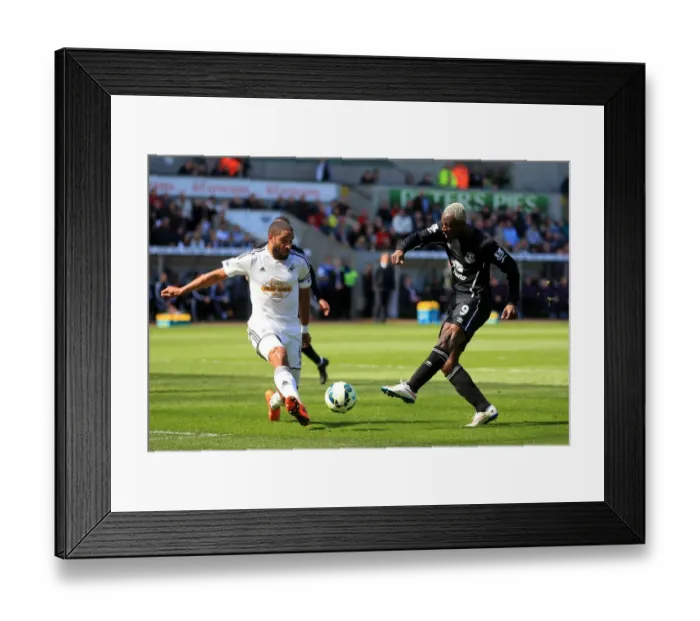 Framed Print : Intense Rivalry: Ashley Williams vs. Arouna Kone Battle at Swansea City's Liberty Stadium - Everton vs. Swansea City, Barclays Premier League