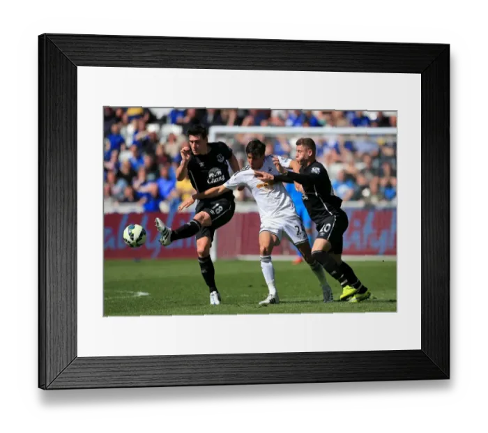 Framed Print : Gareth Barry vs Jack Cork: A Battle of Midfield Masters in Everton vs Swansea City Framed Print : Gareth Barry vs Jack Cork: A Battle of Midfield Masters in Everton vs Swansea City