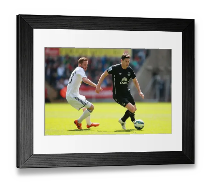 Framed Print : Intense Rivalry: Sigurdsson vs. Barry - Swansea City vs. Everton: A Battle for Supremacy