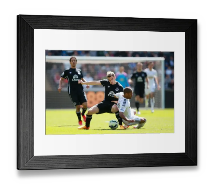 Framed Print : Intense Rivalry: Seamus Coleman vs Wayne Routledge - Swansea City vs Everton, Premier League: A Battle for the Ball Framed Print : Intense Rivalry: Seamus Coleman vs Wayne Routledge - Swansea City vs Everton, Premier League: A Battle for the Ball