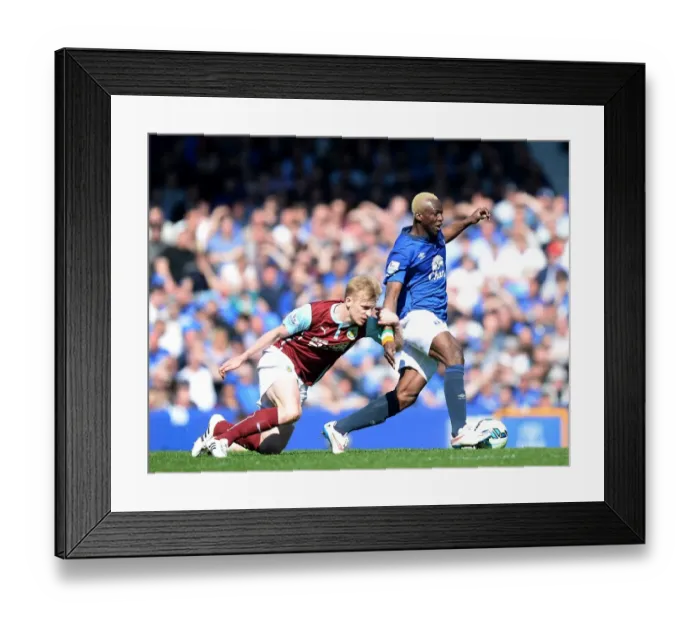 Framed Print : Battle at Goodison Park: Arouna Kone vs Ben Mee - Intense Rivalry on the Football Field