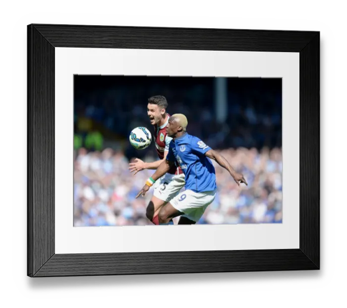 Framed Print : Intense Rivalry: Kone vs. Shackell's Battle for Supremacy at Goodison Park - Everton vs. Burnley, Premier League Framed Print : Intense Rivalry: Kone vs. Shackell's Battle for Supremacy at Goodison Park - Everton vs. Burnley, Premier League