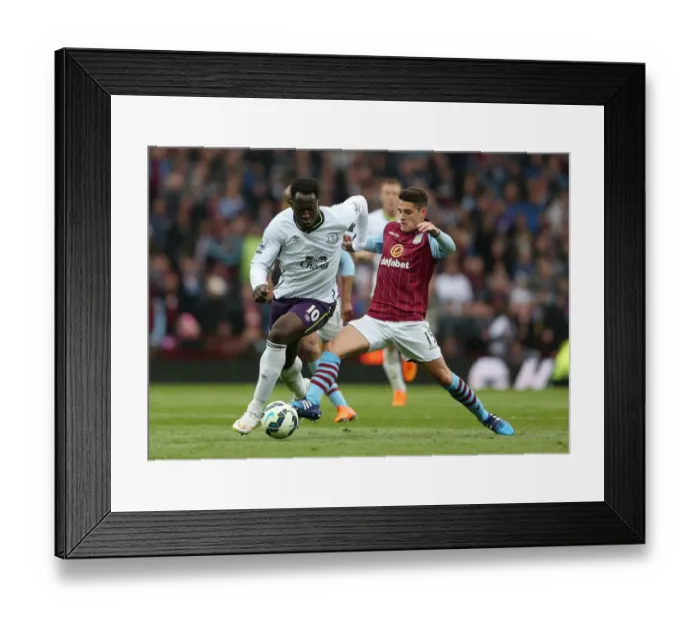 Framed Print : Battle for the Ball: Westwood vs. Lukaku - Aston Villa vs. Everton: Premier League Rivalry Framed Print : Battle for the Ball: Westwood vs. Lukaku - Aston Villa vs. Everton: Premier League Rivalry