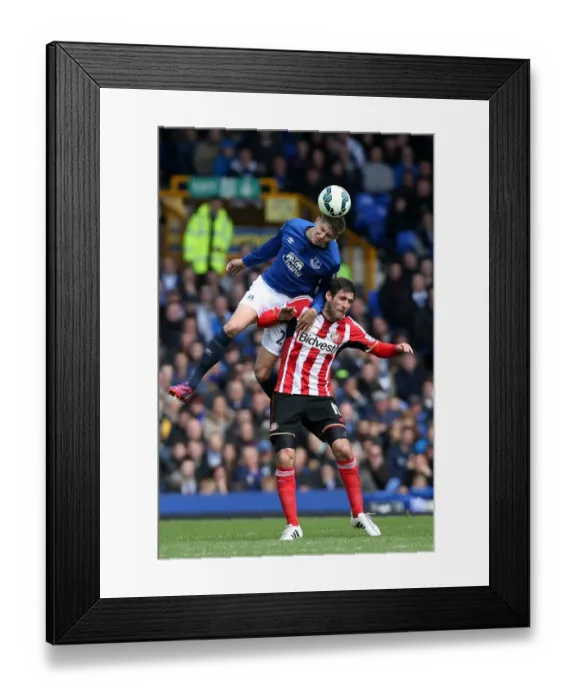 Framed Print : John Stones vs Danny Graham: Aerial Battle in Everton vs Sunderland Premier League Clash at Goodison Park