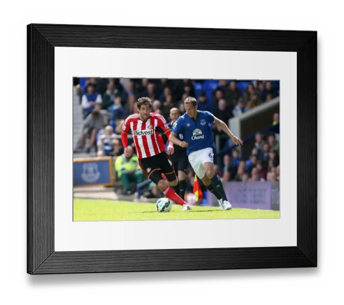 Framed Print : Jagielka vs. Graham: Intense Battle in Everton vs. Sunderland Premier League Clash at Goodison Park Framed Print : Jagielka vs. Graham: Intense Battle in Everton vs. Sunderland Premier League Clash at Goodison Park