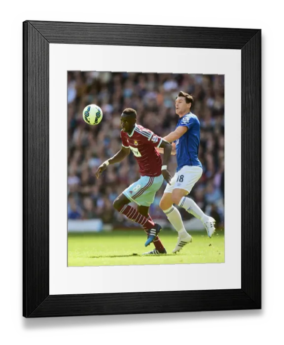 Framed Print : Intense Rivalry: Kouyate vs. Barry at Upton Park - Everton vs. West Ham United, Barclays Premier League Framed Print : Intense Rivalry: Kouyate vs. Barry at Upton Park - Everton vs. West Ham United, Barclays Premier League