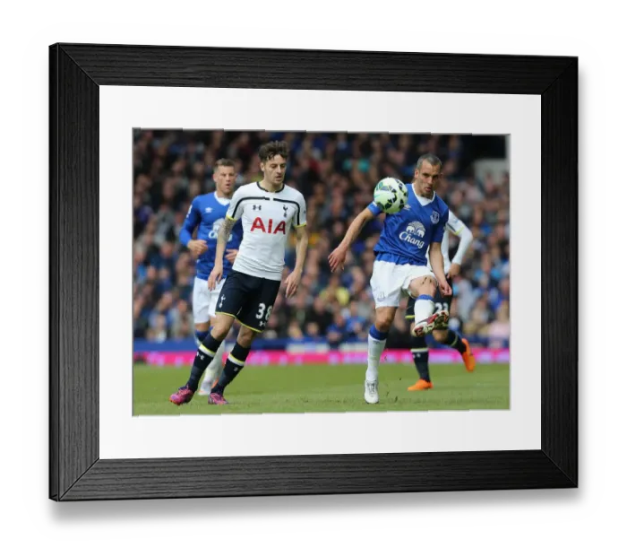 Framed Print : Battle for the Ball: Osman vs. Mason - Everton vs. Tottenham Hotspur, Premier League Rivalry Framed Print : Battle for the Ball: Osman vs. Mason - Everton vs. Tottenham Hotspur, Premier League Rivalry