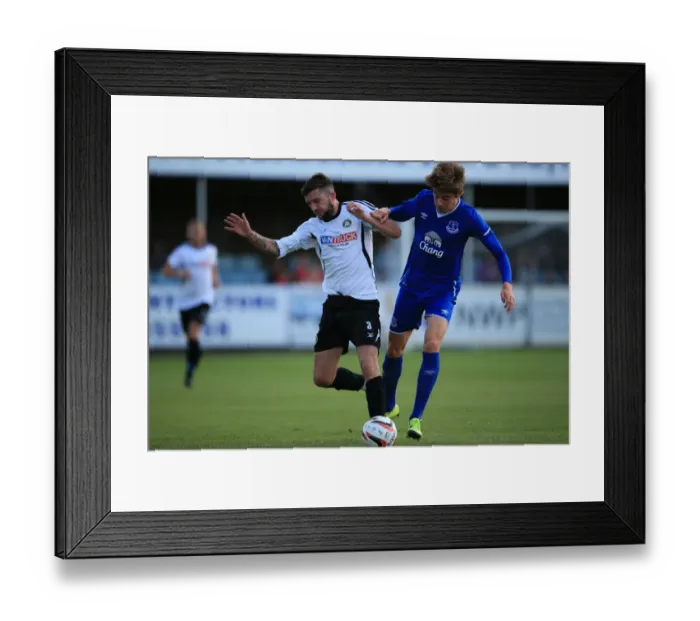 Framed Print : Evans vs Desart: A Fierce Rivalry Unfolds - Everton U21s Pre-Season Battle