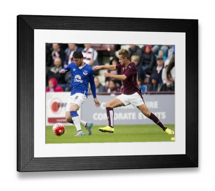 Framed Print : Battling for the Ball: Oviedo vs McGhee - Pre-Season Clash at Tynecastle Stadium Framed Print : Battling for the Ball: Oviedo vs McGhee - Pre-Season Clash at Tynecastle Stadium