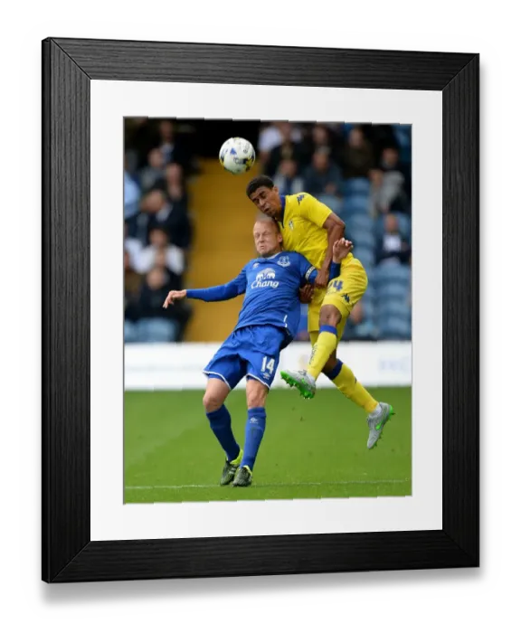 Framed Print : Naismith vs. Adeyemi: A Pre-Season Battle for the Ball at Elland Road - Leeds United vs. Everton Framed Print : Naismith vs. Adeyemi: A Pre-Season Battle for the Ball at Elland Road - Leeds United vs. Everton