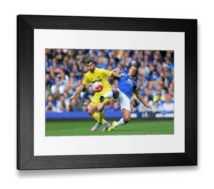 Framed Print : Jagielka vs. Baptistao: A Fierce Rivalry Unfolds - Everton vs. Leeds United Pre-Season Clash at Elland Road Framed Print : Jagielka vs. Baptistao: A Fierce Rivalry Unfolds - Everton vs. Leeds United Pre-Season Clash at Elland Road