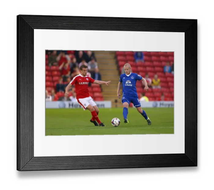 Framed Print : Naismith vs. Winnall: Battle for the Ball in Barnsley vs. Everton Capital One Cup Clash Framed Print : Naismith vs. Winnall: Battle for the Ball in Barnsley vs. Everton Capital One Cup Clash