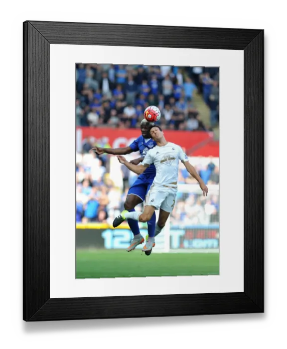 Framed Print : Intense Face-off: Jack Cork vs. Arouna Kone at Swansea City's Liberty Stadium