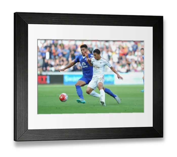 Framed Print : Intense Rivalry: Browning vs. Montero's Battle for Ball Possession (Swansea City vs. Everton, Barclays Premier League) Framed Print : Intense Rivalry: Browning vs. Montero's Battle for Ball Possession (Swansea City vs. Everton, Barclays Premier League)