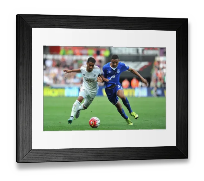 Framed Print : Battling for Possession: Naughton vs Browning in Swansea City vs Everton Premier League Clash Framed Print : Battling for Possession: Naughton vs Browning in Swansea City vs Everton Premier League Clash