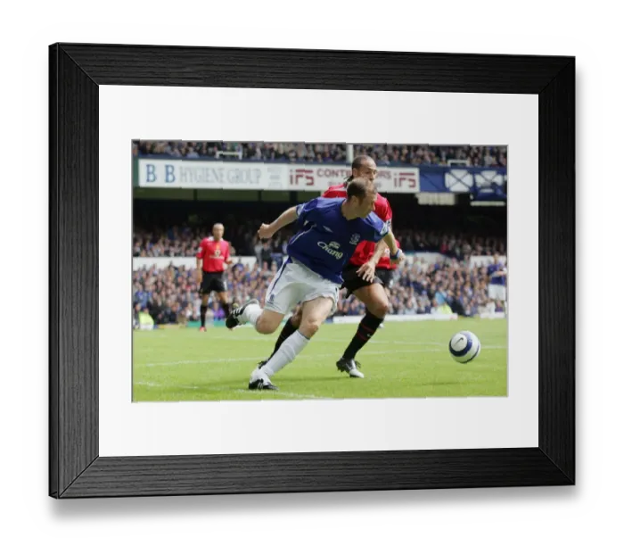 Framed Print : Duncan Ferguson vs. Rio Ferdinand: A Football Rivalry Unfolds in Everton's Season Opener Framed Print : Duncan Ferguson vs. Rio Ferdinand: A Football Rivalry Unfolds in Everton's Season Opener