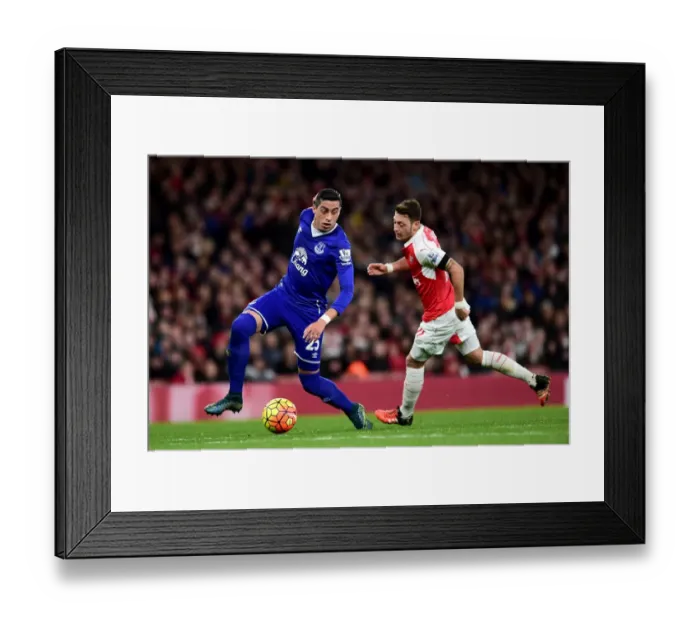 Framed Print : Clash at the Emirates: Funes Mori vs. Ozil - Arsenal vs. Everton, Premier League Showdown Framed Print : Clash at the Emirates: Funes Mori vs. Ozil - Arsenal vs. Everton, Premier League Showdown