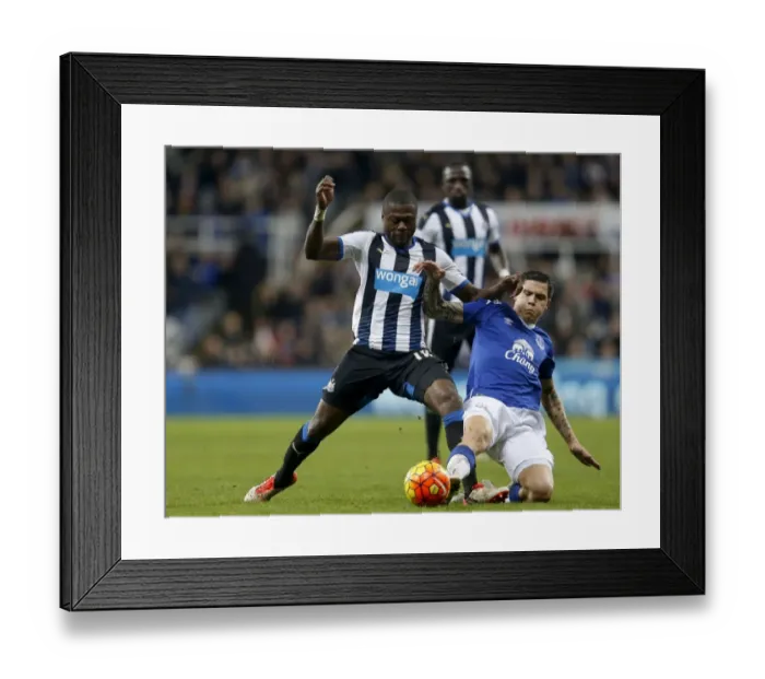 Framed Print : Intense Rivalry: Mbemba vs. Besic's Battle for Ball in Newcastle United vs. Everton Premier League Clash