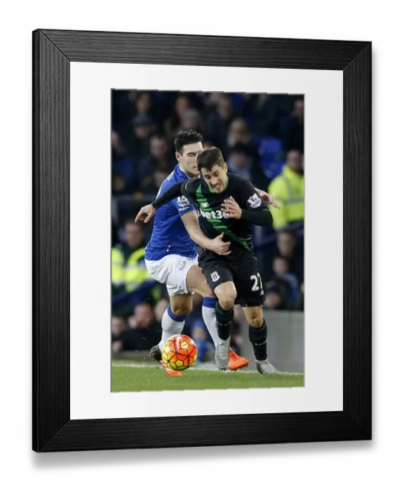 Framed Print : Intense Rivalry: Gareth Barry vs Bojan Krkic - Everton vs Stoke City's Battle for Ball Possession at Goodison Park