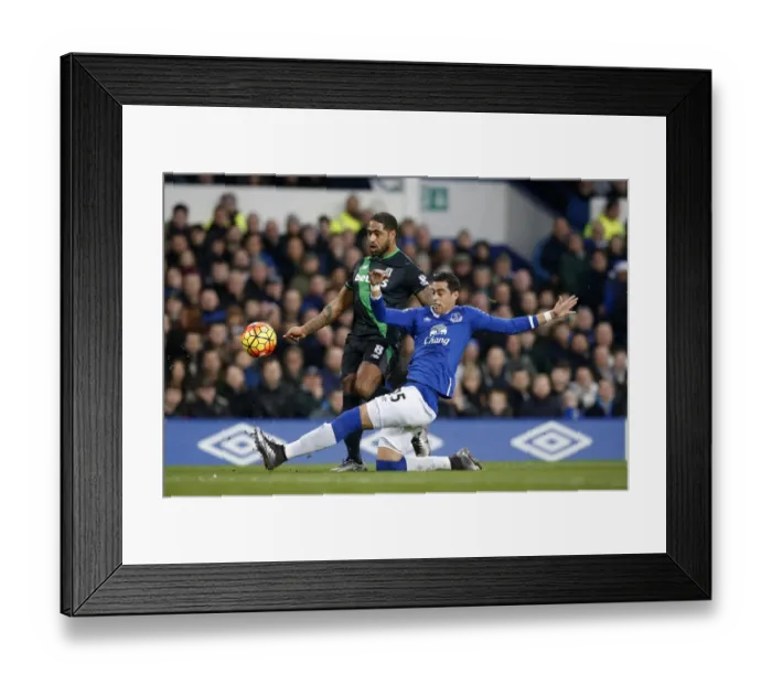 Framed Print : Intense Rivalry: Funes Mori vs. Johnson - Everton vs. Stoke City Football Showdown