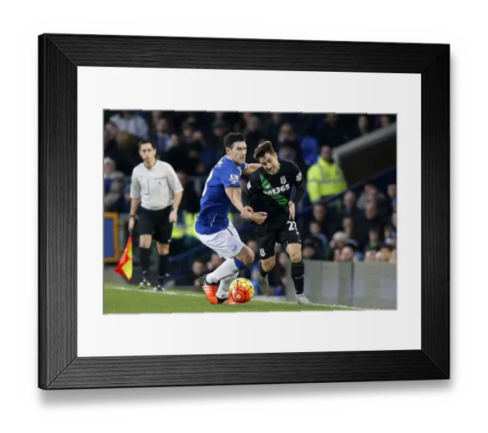 Framed Print : Intense Rivalry: Gareth Barry vs Bojan Krkic - Everton vs Stoke City's Battle for Supremacy at Goodison Park Framed Print : Intense Rivalry: Gareth Barry vs Bojan Krkic - Everton vs Stoke City's Battle for Supremacy at Goodison Park