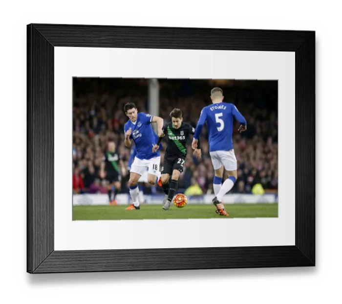Framed Print : Intense Rivalry: Gareth Barry vs Bojan Krkic - Everton vs Stoke City's Battle for Supremacy at Goodison Park